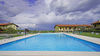 Bilocale con vista lago in residence con piscina