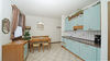Zweizimmerwohnung mit zwei terrassierten Gärten und Stellplatz, in Residenz mit Pool, in Gardone Riviera zu verkaufen
