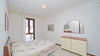 Leuchtende Dreizimmerwohnung auf einer Ebene mit wunderschöner Terrasse in Gardone Riviera zum Verkauf