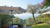 Dreizimmerwohnung mit Seeblick und privatem Garten, in gepflegter Residenz mit Pool, in Gardone Riviera zu verkaufen