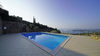 Dreizimmerwohnung mit Seeblick und privatem Garten, in gepflegter Residenz mit Pool, in Gardone Riviera zu verkaufen