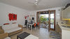 Dreizimmerwohnung mit Seeblick und privatem Garten, in gepflegter Residenz mit Pool, in Gardone Riviera zu verkaufen