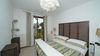 Dreizimmerwohnung mit Seeblick und privatem Garten, in gepflegter Residenz mit Pool, in Gardone Riviera zu verkaufen