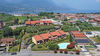 Leuchtende Dreizimmerwohnung mit exklusiver Terrasse und Garage in Residenz mit Pool, in Portese zu verkaufen