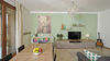 Leuchtende Dreizimmerwohnung mit exklusiver Terrasse und Garage in Residenz mit Pool, in Portese zu verkaufen