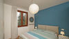 Leuchtende Dreizimmerwohnung mit exklusiver Terrasse und Garage in Residenz mit Pool, in Portese zu verkaufen