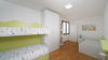 Leuchtende Dreizimmerwohnung mit exklusiver Terrasse und Garage in Residenz mit Pool, in Portese zu verkaufen