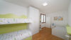 Leuchtende Dreizimmerwohnung mit exklusiver Terrasse, in Residenz mit Pool in Portese zum Verkauf